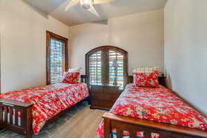 Bedroom with ceiling fan and carpet flooring