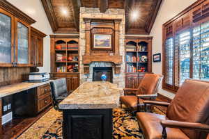 Office with dark wood-type flooring, a fireplace, wooden ceiling, and recessed lighting