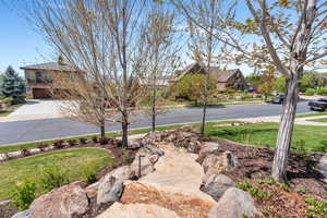 View of grassy yard featuring a residential view