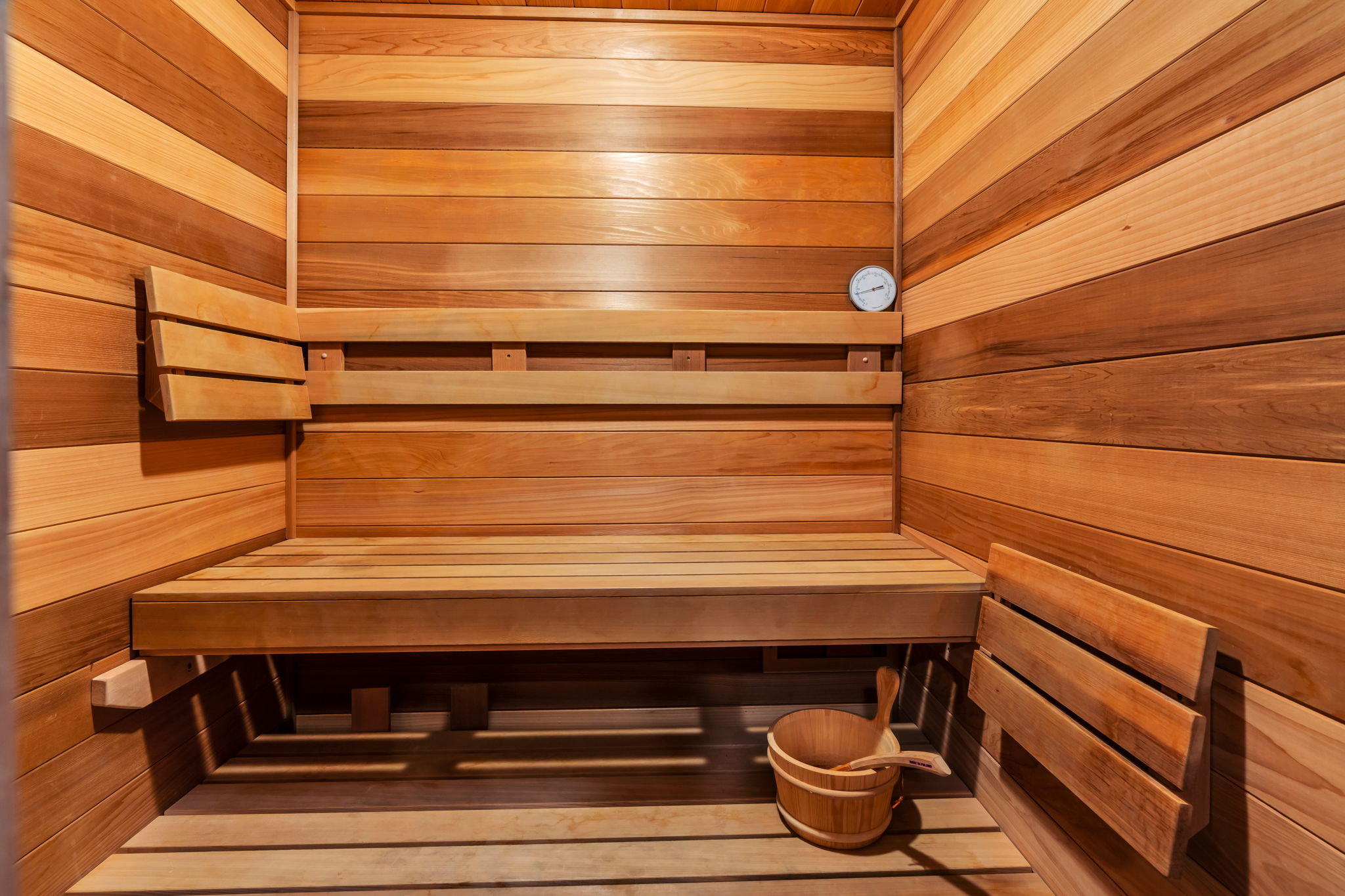 Sauna / steam room with wood walls