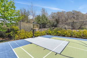 View of basketball court featuring community basketball court