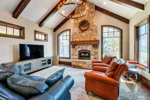Living room featuring a fireplace and a chandelier
