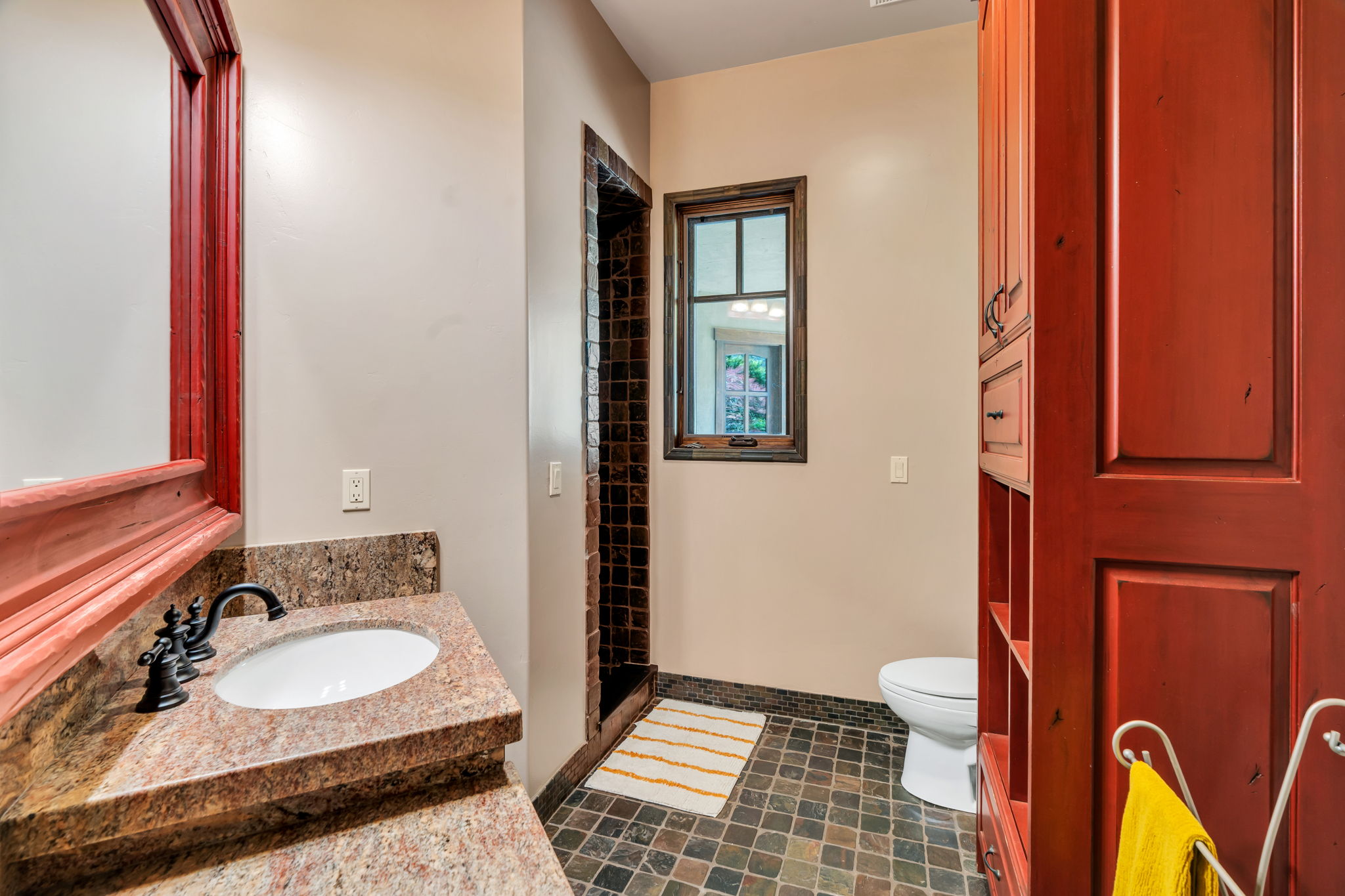 Bathroom with vanity and a shower stall