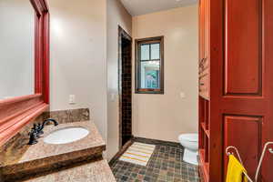 Bathroom with vanity and a shower stall