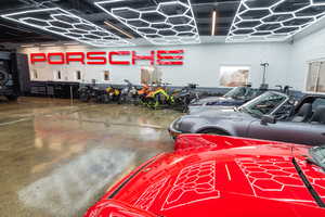 Garage featuring concrete block wall