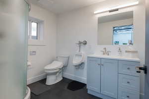 Bathroom featuring vanity and a stall shower