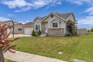 Ranch-style home with brick siding, driveway, a garage, and a shingled roof