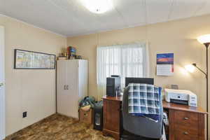 Office space featuring a textured ceiling.