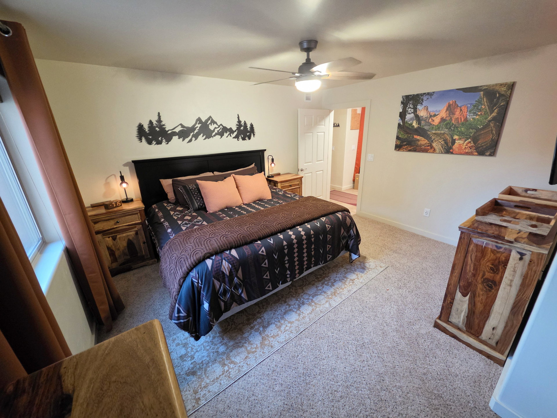 Bedroom featuring light-colored walls and neutral-toned carpeting