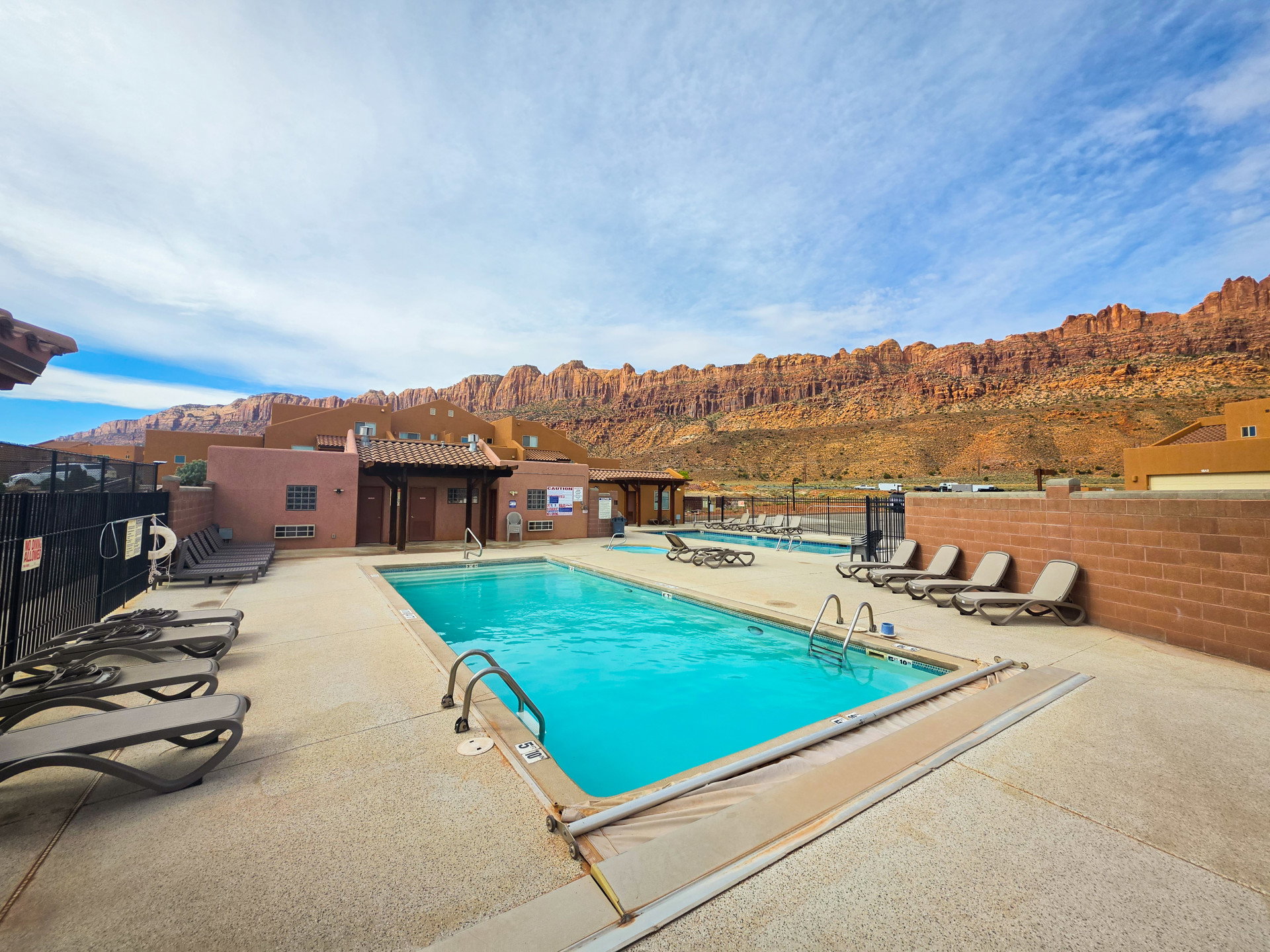 Community pool featuring a mountain view and a patio area