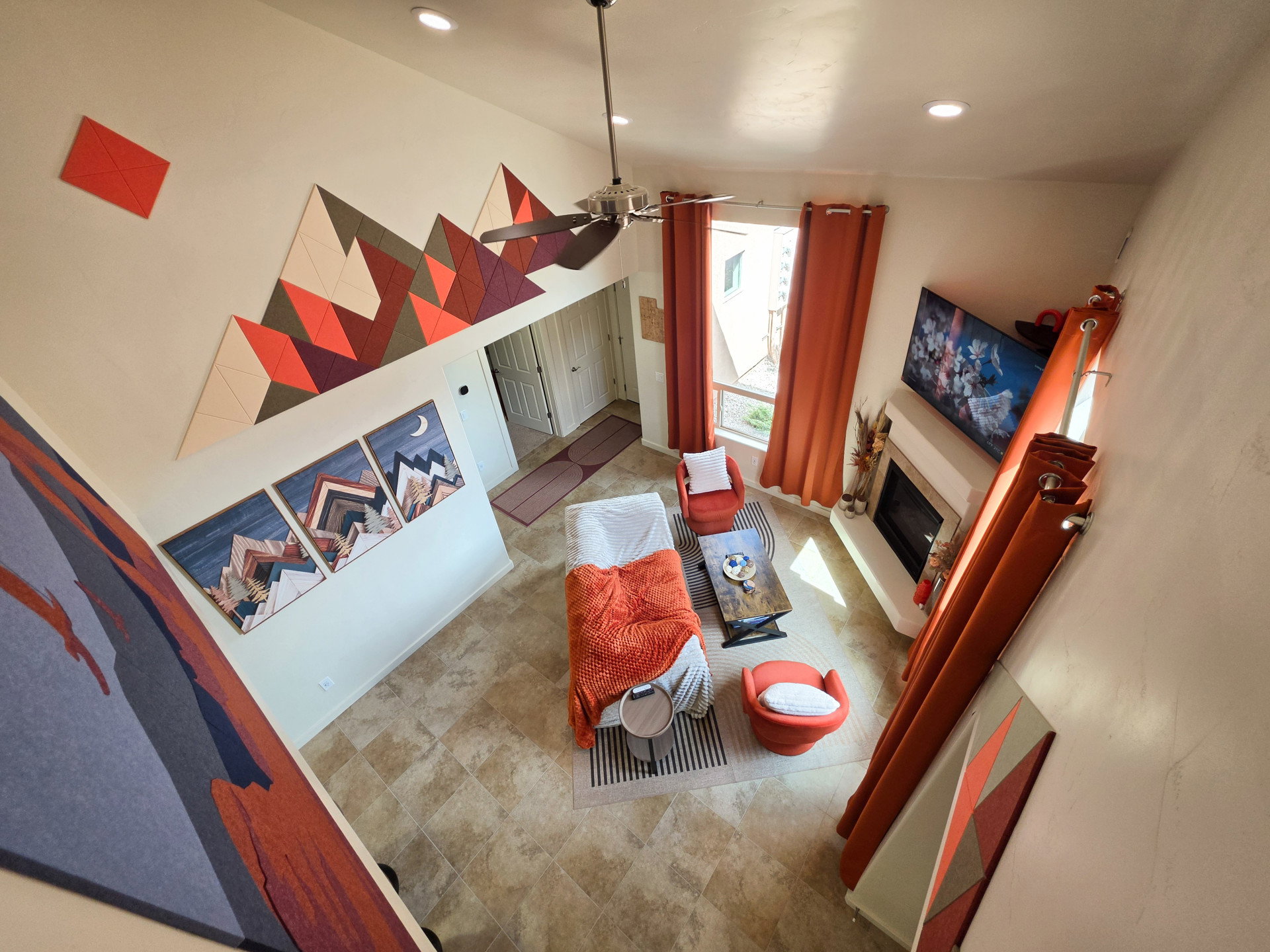 Bright living area featuring high ceilings, recessed lighting, and a ceiling fan