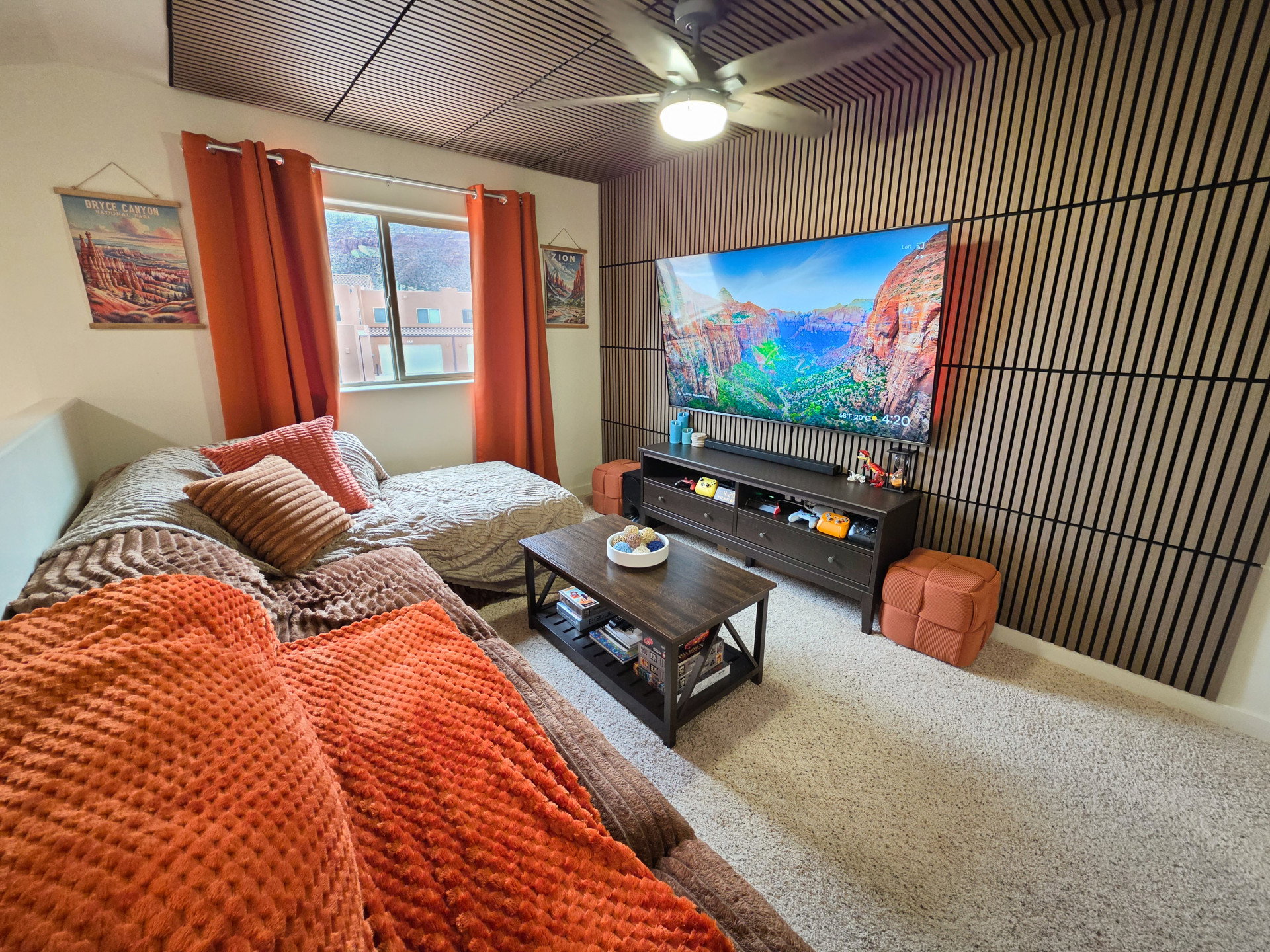 Feature wall with linear wood-finish paneling and integrated ceiling fan