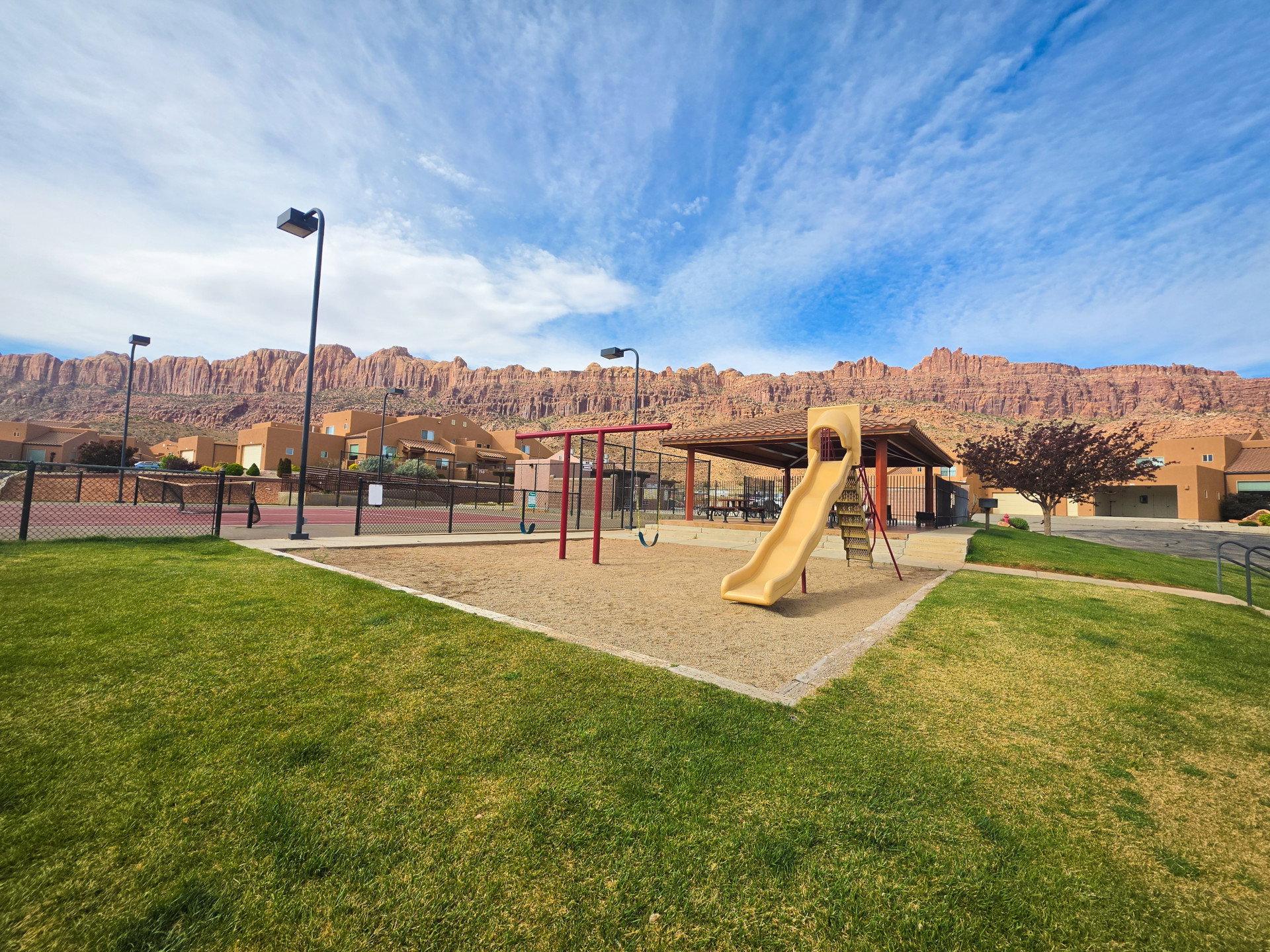 Community jungle gym with a patio and a mountain view