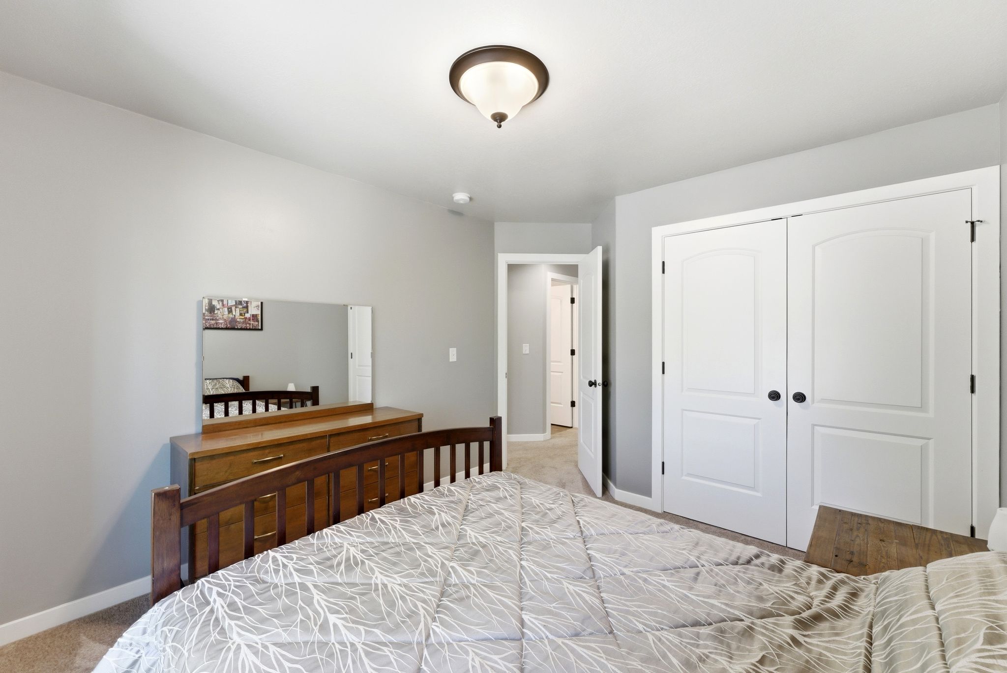 Bedroom featuring a closet and light carpet