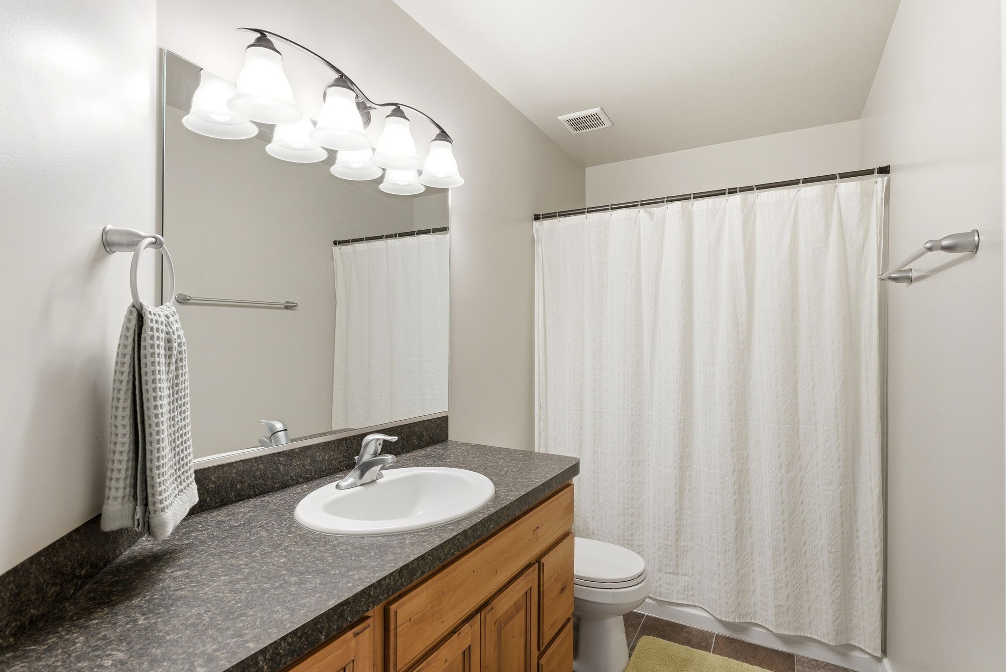 Full bath with vanity and toilet