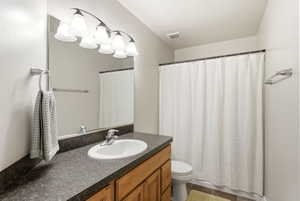 Full bath with vanity and toilet