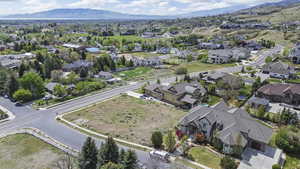 Aerial view of residential area featuring a mountain backdrop