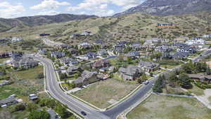 View of property location featuring mountains and nearby suburban area