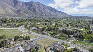 Aerial view of residential area featuring a mountainous background