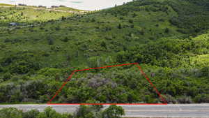 Aerial view of property and surrounding area with property parcel outlined