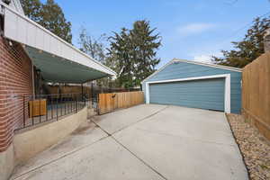 Detached garage with a gate