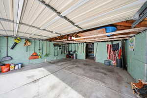 Garage with a garage door opener - storage in the back room.
