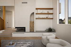 Living area featuring parquet flooring and a multi sided fireplace