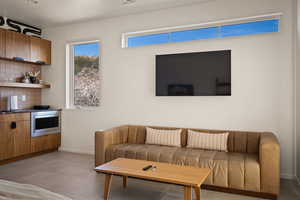 Living area featuring baseboards