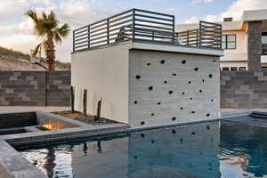 View of pool featuring an outdoor fire pit