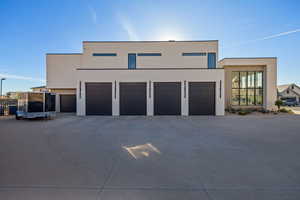 Modern home featuring driveway and stucco siding