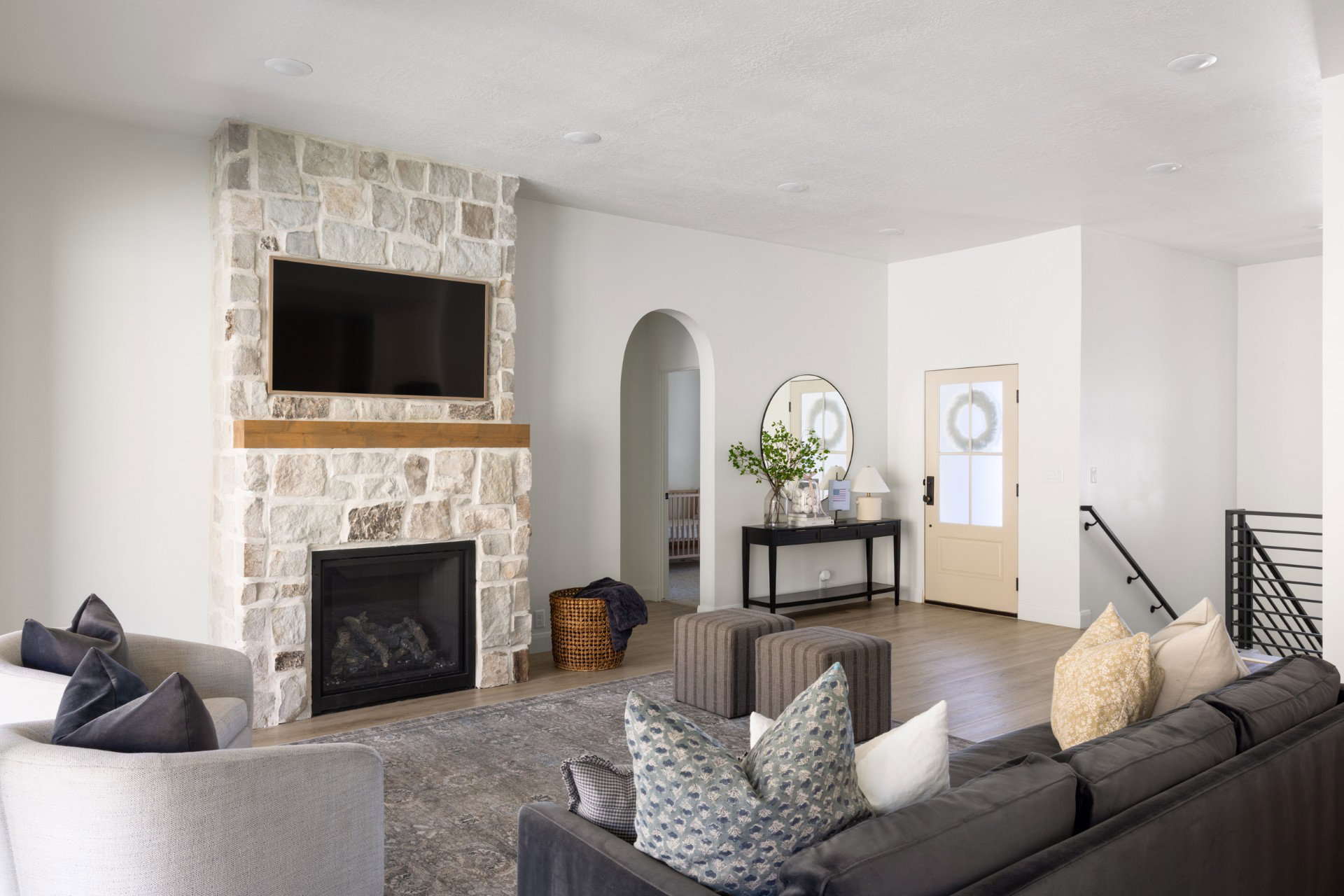 Stone-clad fireplace with a wood mantle