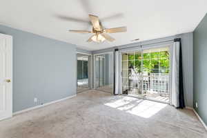 Bedroom featuring Balcony, carpet, ceiling fan, and multiple closets