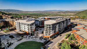 Bird's eye view of mountains and apartment complex