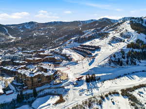Snowy aerial view featuring a mountain view