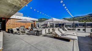 View of patio / terrace featuring a mountain view and outdoor dining space