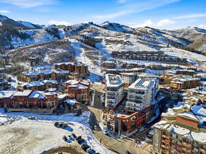 Snowy aerial view featuring a mountain view