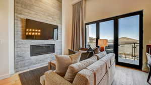 Living area featuring a fireplace and light wood-style flooring