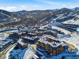 Snowy aerial view featuring a mountain view