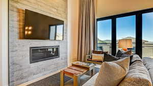 Living area with a glass covered fireplace