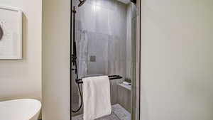 Full bath featuring a stall shower and a freestanding tub