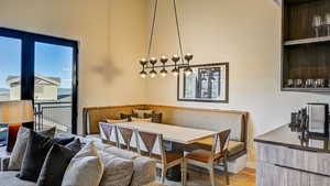 Dining room with breakfast area and light wood-style flooring