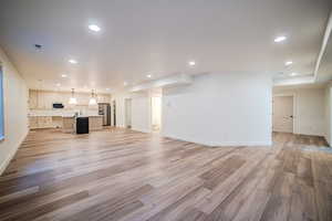 Unfurnished living room with recessed lighting and light wood-style flooring