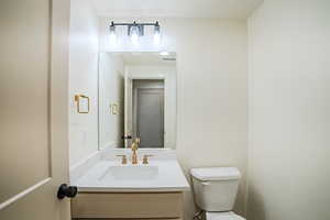 Bathroom with vanity and toilet