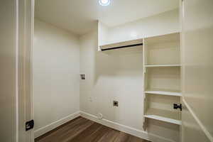 Laundry area featuring washer hookup, dark wood finished floors, and hookup for an electric dryer