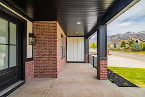 Porch featuring a mountain view and a residential view