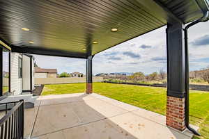 Fenced backyard with a patio