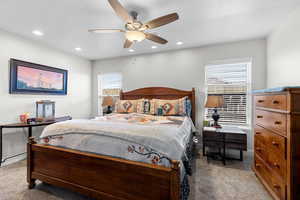 Bedroom featuring a ceiling fan, carpet floors, a textured ceiling, and recessed lighting