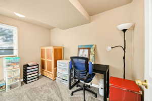 Office area featuring carpet floors and baseboards