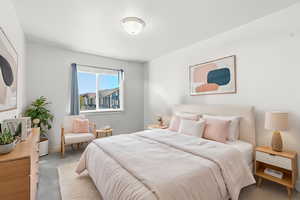 Bedroom with carpet and baseboards