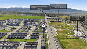 View of property location with mountains and nearby suburban area